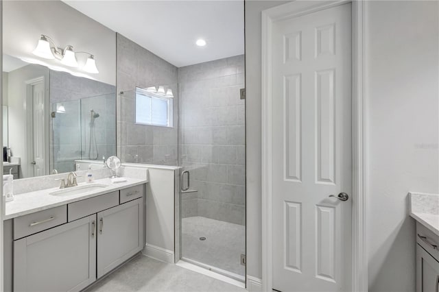 6219 Golden Nettle Dr, Apollo Beach, FL 33572 - bathroom featuring vanity, a stall shower, and tile patterned flooring