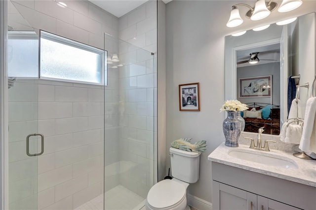 6219 Golden Nettle Dr, Apollo Beach, FL 33572 - full bathroom with vanity, a shower stall, connected bathroom, and a ceiling fan
