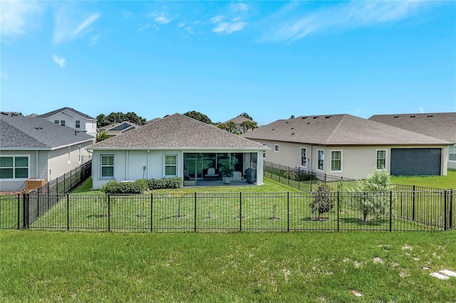 6219 Golden Nettle Dr, Apollo Beach, FL 33572 - rear view of property featuring a shingled roof, a sunroom, stucco siding, and a fenced backyard