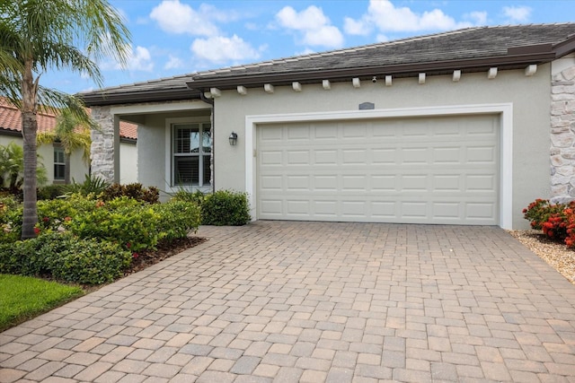 2316 Springhaven Ln, Lakewood Ranch, FL 34211 - garage with decorative driveway