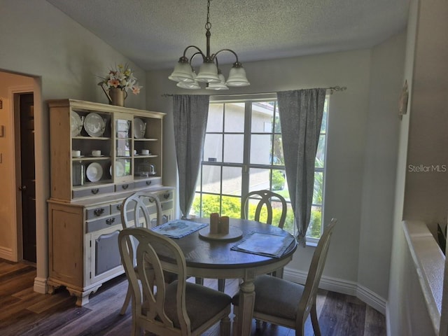 15917 Mercott Ct, Clermont, FL 34714 - dining room with a chandelier, dark wood-type flooring, and a textured ceiling