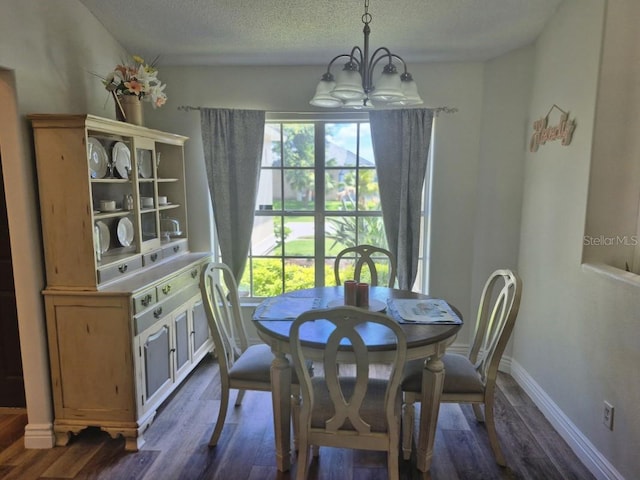 15917 Mercott Ct, Clermont, FL 34714 - dining area with a chandelier, dark wood-type flooring, and a textured ceiling