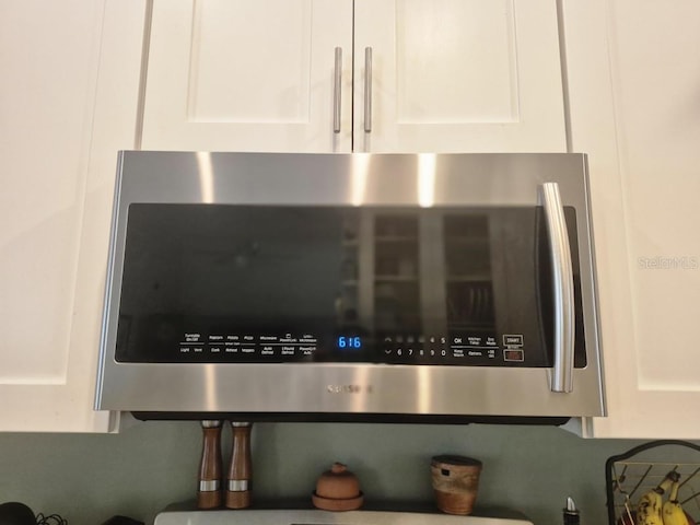 15917 Mercott Ct, Clermont, FL 34714 - kitchen view of stainless steel microwave and white cabinetry