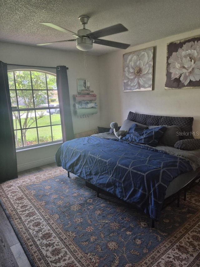 15917 Mercott Ct, Clermont, FL 34714 - bedroom with a textured ceiling and ceiling fan