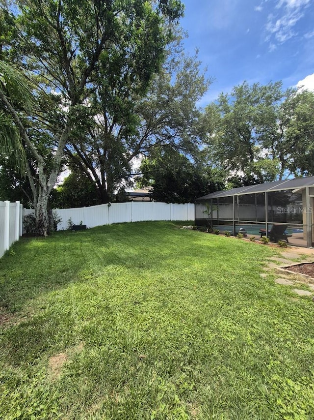 15917 Mercott Ct, Clermont, FL 34714 - fenced backyard with a swimming pool and glass enclosure