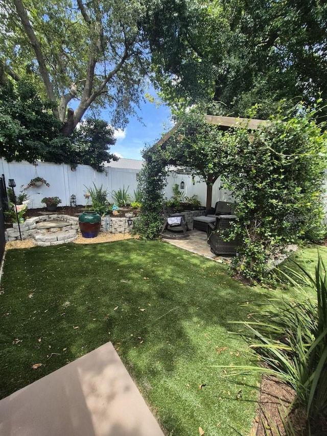 15917 Mercott Ct, Clermont, FL 34714 - fenced backyard with a patio area and outdoor lounge area