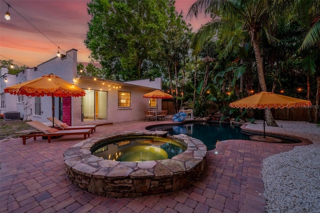 522 31st St W, Bradenton, FL 34205 - pool at dusk with a patio and a pool with connected hot tub