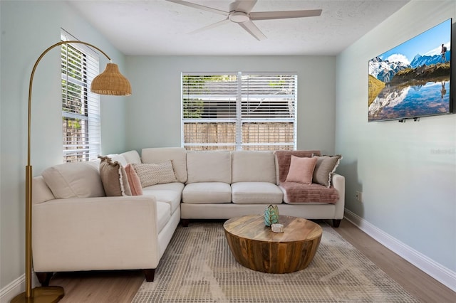 522 31st St W, Bradenton, FL 34205 - living room with wood finished floors, ceiling fan, and a textured ceiling