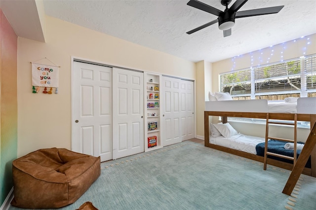 522 31st St W, Bradenton, FL 34205 - carpeted bedroom with a textured ceiling and a ceiling fan