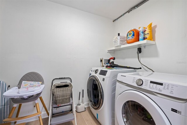 522 31st St W, Bradenton, FL 34205 - washroom featuring washing machine and clothes dryer and light wood finished floors
