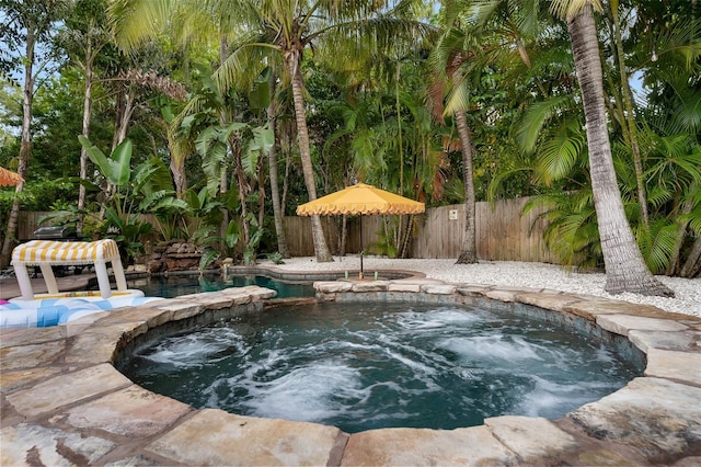 522 31st St W, Bradenton, FL 34205 - view of pool featuring a fenced backyard and a pool with connected hot tub
