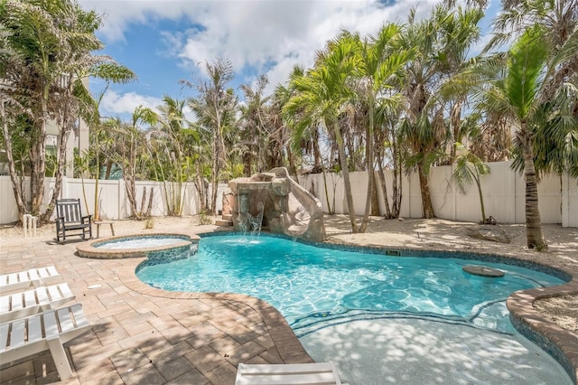 538 Canal Rd, Sarasota, FL 34242 - view of swimming pool featuring a patio area, a fenced backyard, and a pool with connected hot tub