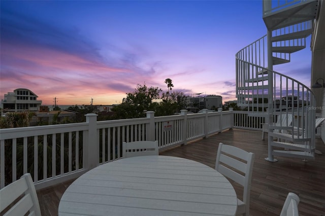 538 Canal Rd, Sarasota, FL 34242 - wooden deck with stairs and outdoor dining space