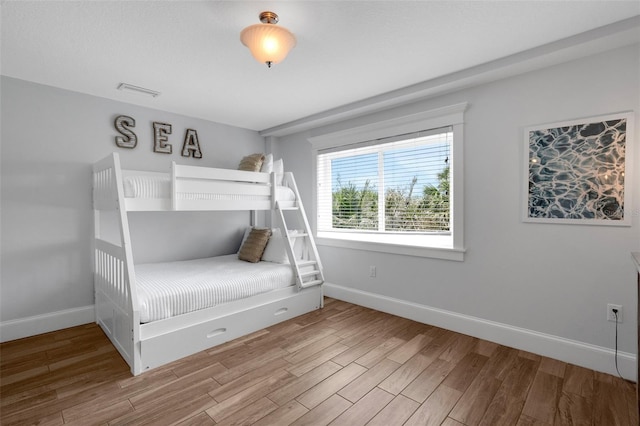 538 Canal Rd, Sarasota, FL 34242 - bedroom featuring baseboards and wood finished floors