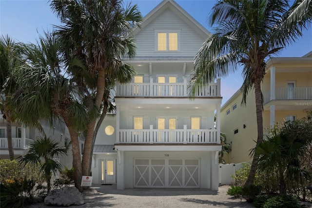 538 Canal Rd, Sarasota, FL 34242 - beach home with a balcony, driveway, a garage, and stucco siding
