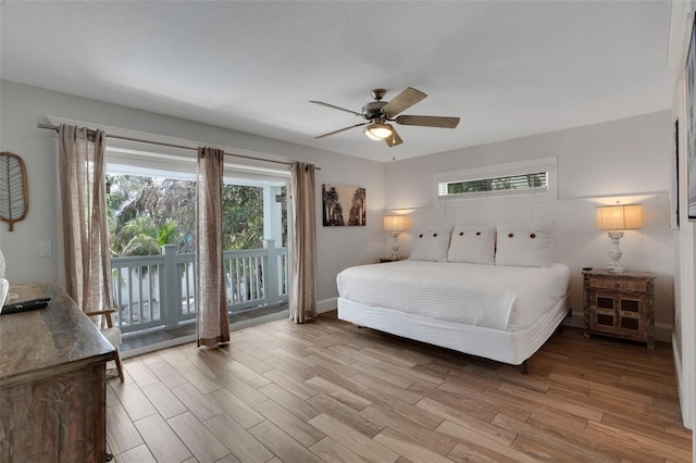 538 Canal Rd, Sarasota, FL 34242 - bedroom featuring access to outside, wood finished floors, multiple windows, and a ceiling fan