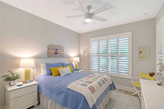7983 Sandstar Way, Sarasota, FL 34240 - bedroom featuring light wood-style flooring and ceiling fan