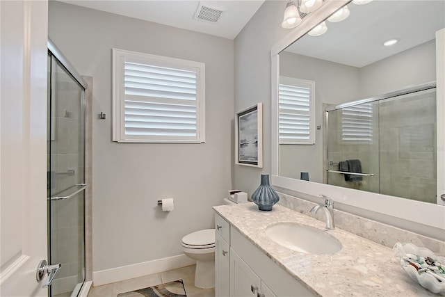 7983 Sandstar Way, Sarasota, FL 34240 - bathroom featuring plenty of natural light, vanity, a shower stall, and tile patterned floors