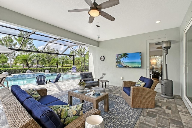 7983 Sandstar Way, Sarasota, FL 34240 - view of patio / terrace with an outdoor hangout area, an outdoor pool, a ceiling fan, and glass enclosure