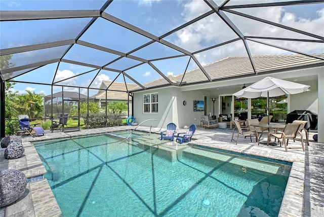 7983 Sandstar Way, Sarasota, FL 34240 - view of pool with a patio, a grill, and a pool with connected hot tub