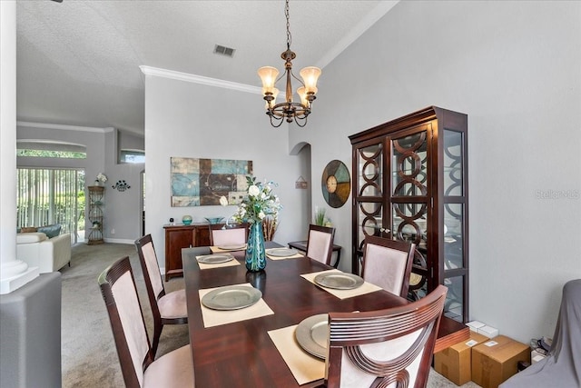 4013 Greystone Dr, Clermont, FL 34711 - dining area featuring ornamental molding, a chandelier, carpet, and a textured ceiling