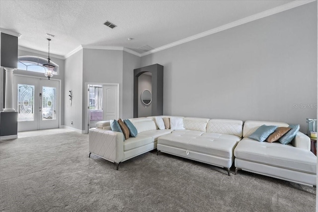 4013 Greystone Dr, Clermont, FL 34711 - living room featuring carpet, crown molding, french doors, and a textured ceiling