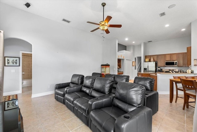 4013 Greystone Dr, Clermont, FL 34711 - living area with a ceiling fan, light tile patterned floors, arched walkways, and recessed lighting