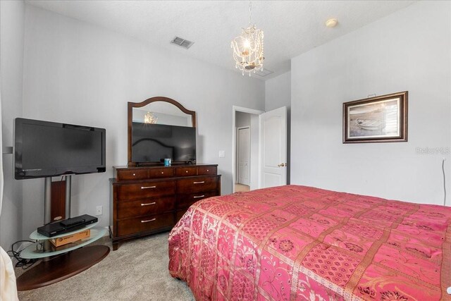 4013 Greystone Dr, Clermont, FL 34711 - bedroom featuring light colored carpet and a chandelier