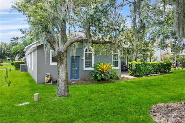 4013 Greystone Dr, Clermont, FL 34711 - view of property exterior featuring a lawn and stucco siding