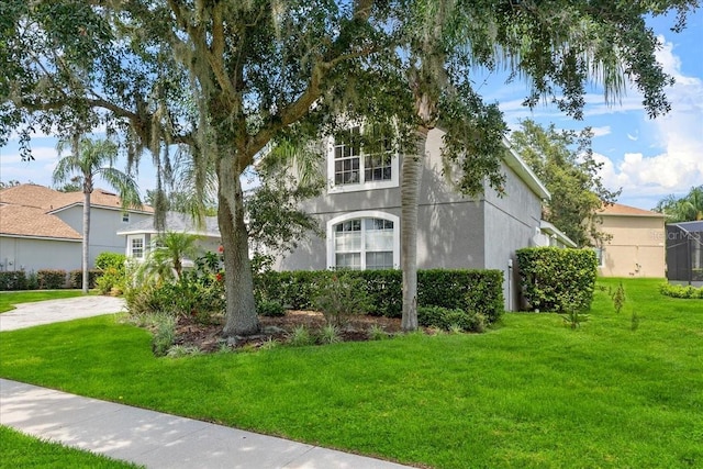 4013 Greystone Dr, Clermont, FL 34711 - view of front of home featuring a front lawn and stucco siding