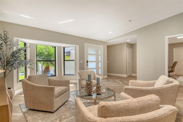 2103 Harbourside Dr Unit 1102, Longboat Key, FL 34228 - living area with baseboards and lofted ceiling