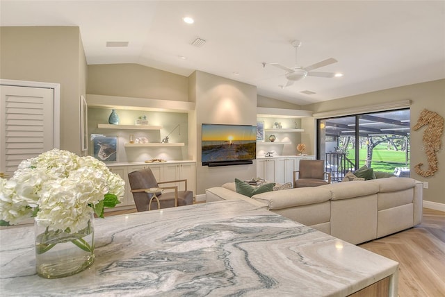 2103 Harbourside Dr Unit 1102, Longboat Key, FL 34228 - living area with lofted ceiling and a ceiling fan