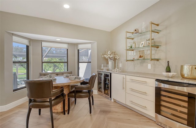 2103 Harbourside Dr Unit 1102, Longboat Key, FL 34228 - dining space with beverage cooler, a dry bar, and recessed lighting