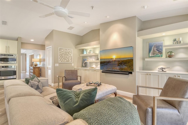 2103 Harbourside Dr Unit 1102, Longboat Key, FL 34228 - living area with light wood finished floors, a ceiling fan, vaulted ceiling, recessed lighting, and built in shelves