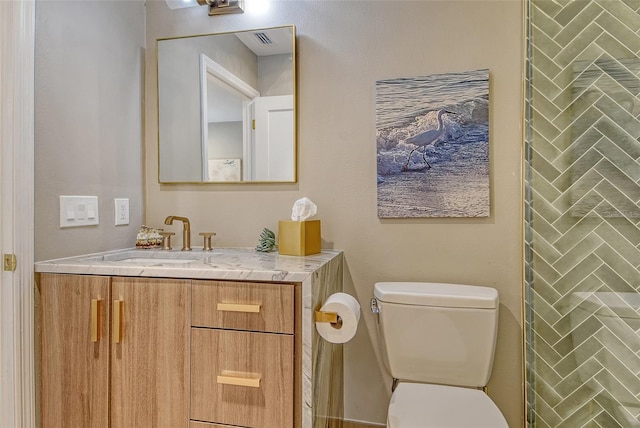 2103 Harbourside Dr Unit 1102, Longboat Key, FL 34228 - bathroom with vanity and toilet
