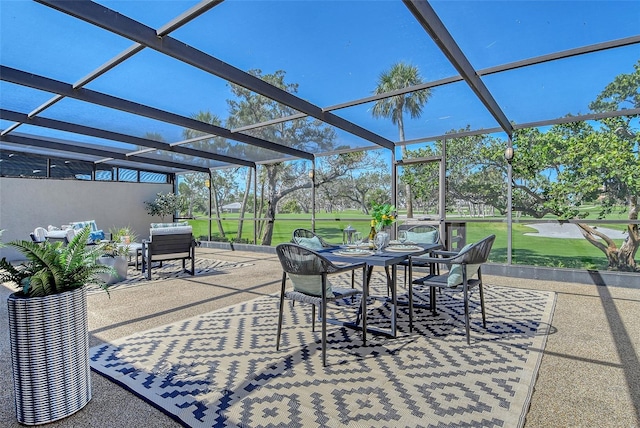 2103 Harbourside Dr Unit 1102, Longboat Key, FL 34228 - view of patio / terrace featuring outdoor dining space and glass enclosure