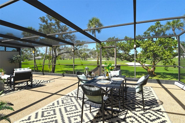 2103 Harbourside Dr Unit 1102, Longboat Key, FL 34228 - view of patio / terrace with view of golf course, a lanai, a grill, and outdoor dining area