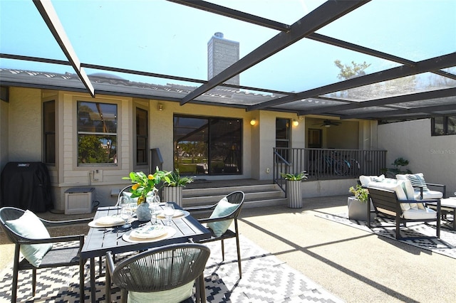 2103 Harbourside Dr Unit 1102, Longboat Key, FL 34228 - view of patio / terrace featuring a ceiling fan, a lanai, outdoor dining space, and a grill