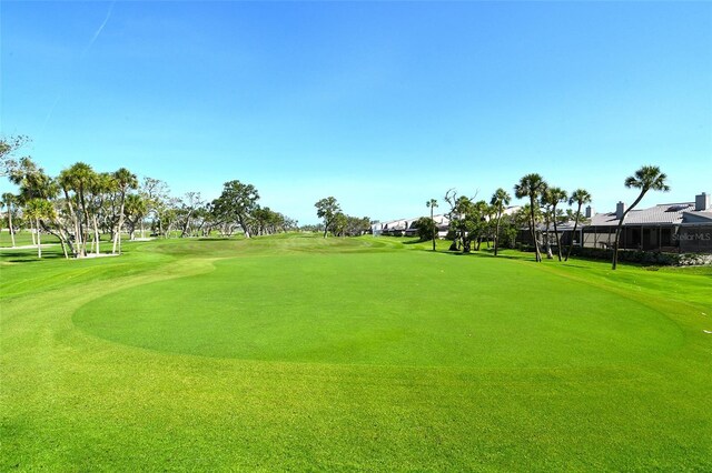 2103 Harbourside Dr Unit 1102, Longboat Key, FL 34228 - view of home's community with view of golf course and a yard