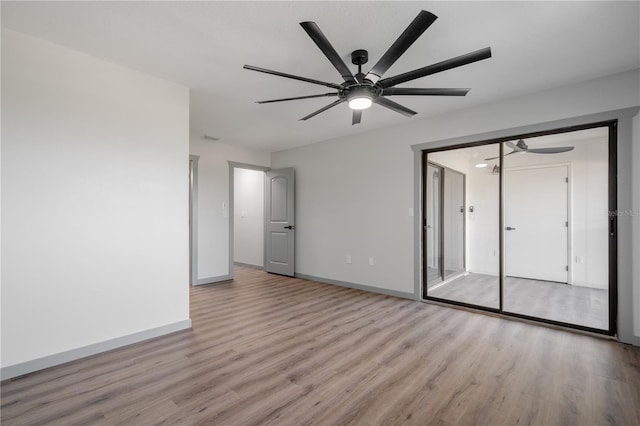 2395 Harbor Blvd Unit 314, Port Charlotte, FL 33952 - empty room featuring ceiling fan and wood finished floors