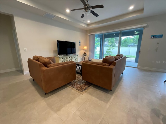 4428 Conchfish Ln, Osprey, FL 34229 - living room featuring a raised ceiling, a ceiling fan, recessed lighting, and light tile patterned flooring