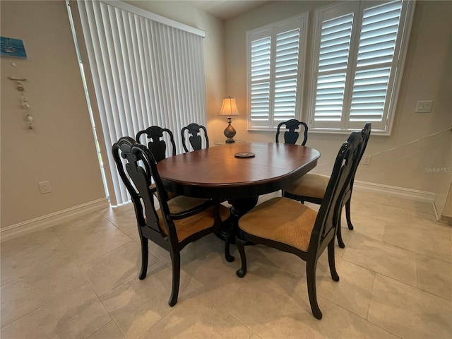 4428 Conchfish Ln, Osprey, FL 34229 - dining space with baseboards and light tile patterned flooring