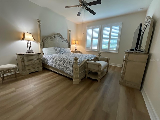 4428 Conchfish Ln, Osprey, FL 34229 - bedroom with wood finished floors and a ceiling fan