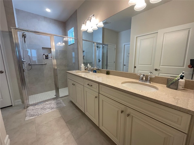 4428 Conchfish Ln, Osprey, FL 34229 - bathroom featuring double vanity, a stall shower, and tile patterned flooring