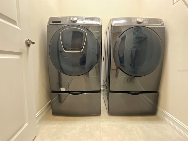 4428 Conchfish Ln, Osprey, FL 34229 - washroom featuring washer and dryer and baseboards