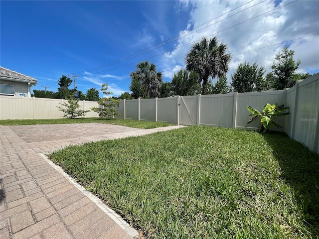 4428 Conchfish Ln, Osprey, FL 34229 - fenced backyard with a patio area