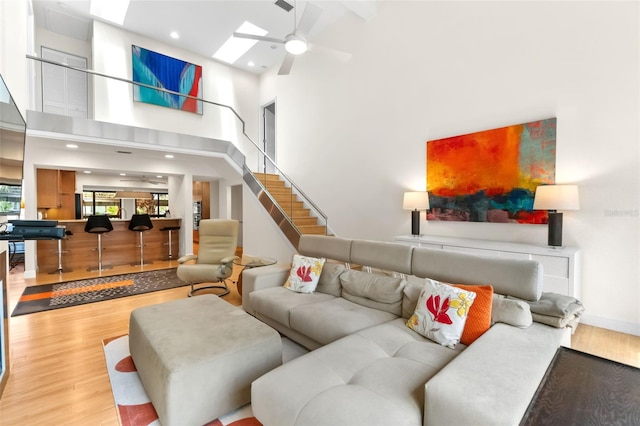 1347 Landings Dr Unit 6, Sarasota, FL 34231 - living area with wood finished floors, a towering ceiling, ceiling fan, recessed lighting, and stairway