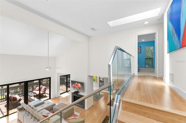 1347 Landings Dr Unit 6, Sarasota, FL 34231 - stairs with a skylight, wood finished floors, high vaulted ceiling, recessed lighting, and beamed ceiling