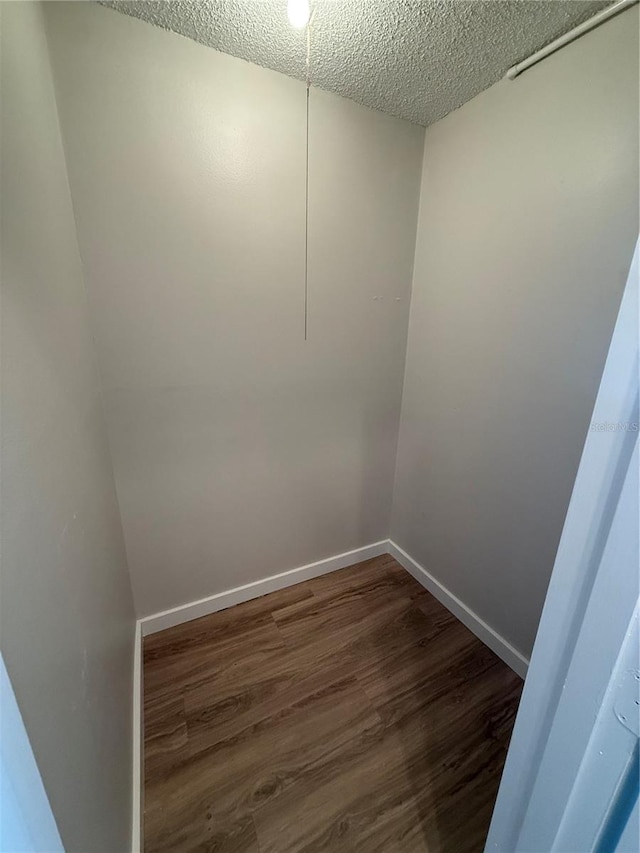 2613 Pine Lake Ter Unit C, Sarasota, FL 34237 - empty room with a textured ceiling and wood finished floors
