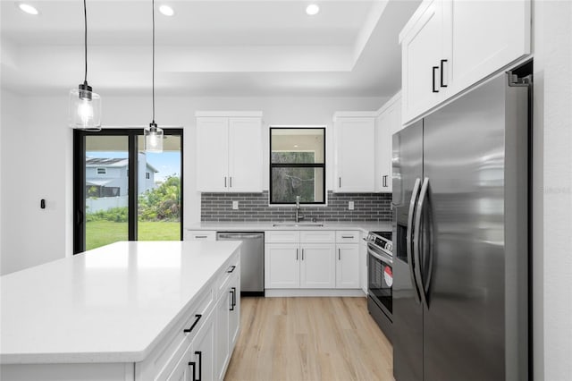 1532 Maricopa Rd, North Port, FL 34287 - kitchen featuring appliances with stainless steel finishes, recessed lighting, healthy amount of natural light, light countertops, and decorative backsplash